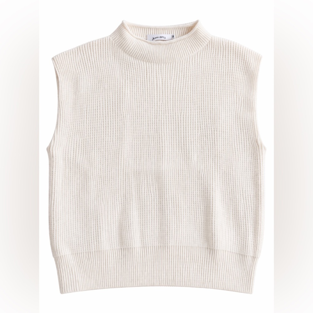 White sleeveless mockneck sweater